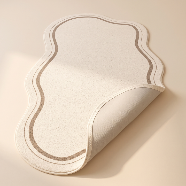 Irregular Shaped Plush Rug – Wavy Edge in Cream – top-down view with one corner flipped up showing the underside