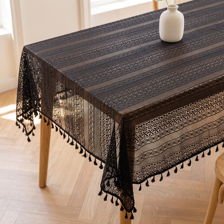 Lace Tablecloth with Tassels in Black – tassel edge hanging past table leg beside wooden chair