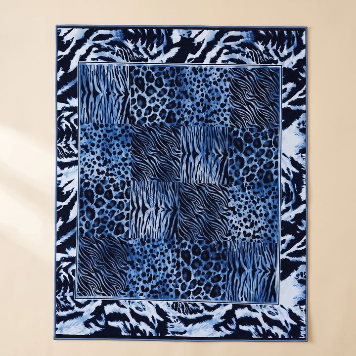 Leopard Print Rug – Washable in Blue – laid flat on a plain beige background, seen from above