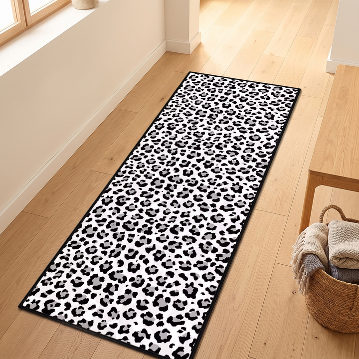 Leopard Print Runner Rug – Washable in White – laid on a light wood hallway floor beside a bench