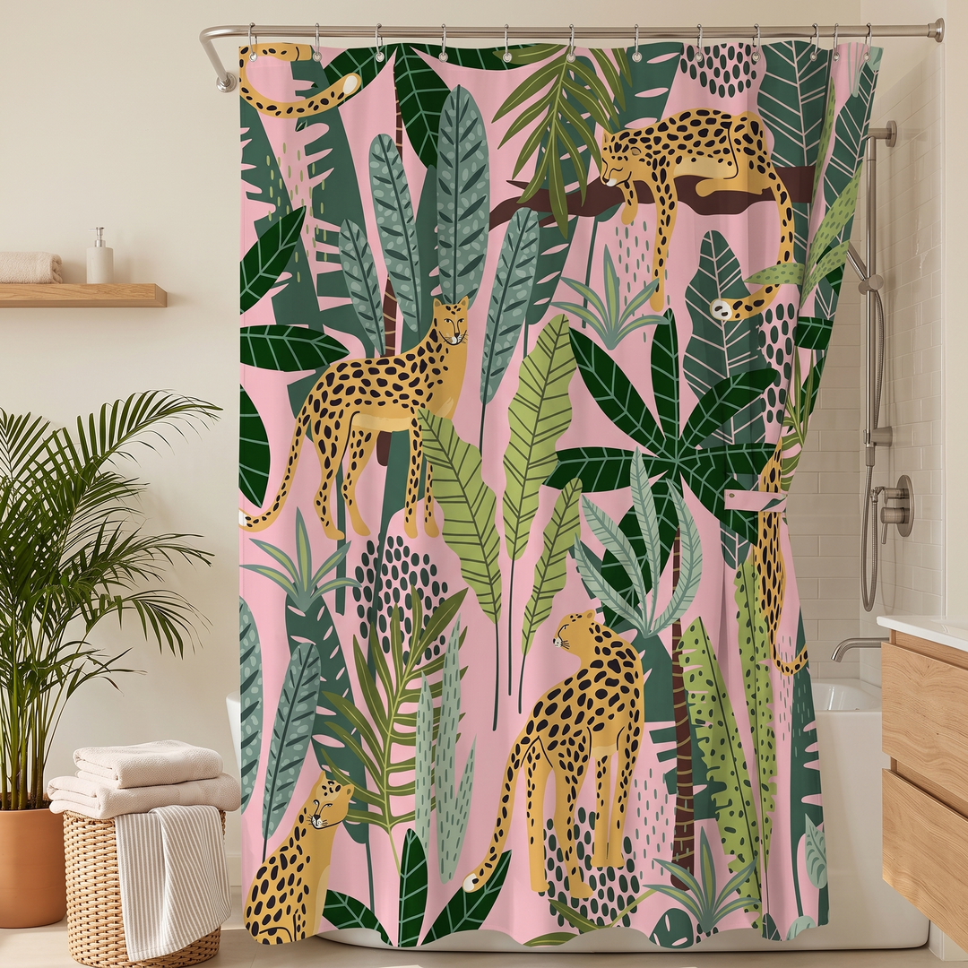 Boho Leopard Print Shower Curtain in Pink – Palm Leopard – closed beside woven towel basket and handheld shower