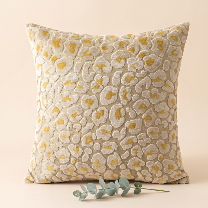 Leopard Print Velvet Pillow Cover in Gold &amp; Beige – styled with a eucalyptus sprig lying across its base