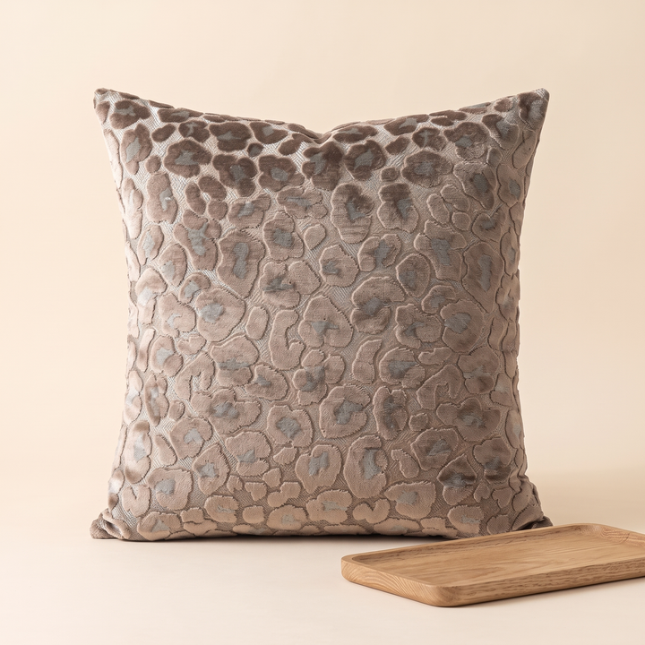 Leopard Print Velvet Pillow Cover in Taupe – with a slim wooden tray in the lower right foreground