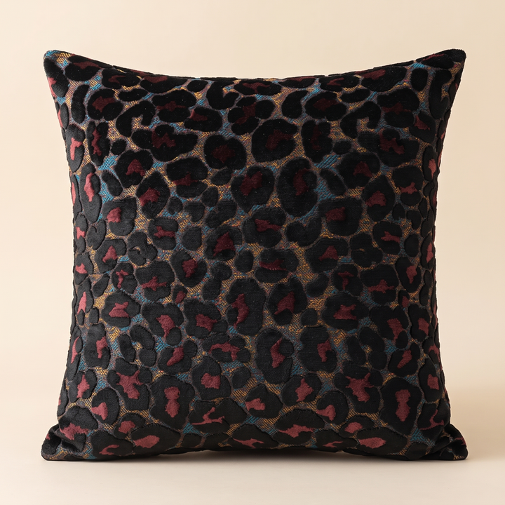 Leopard Print Velvet Pillow Cover in Black – standing upright against a plain beige backdrop, front view
