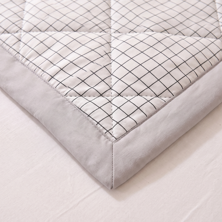 Lightweight Quilted Coverlet in White Grid – close-up of a corner with grey border and diamond quilting