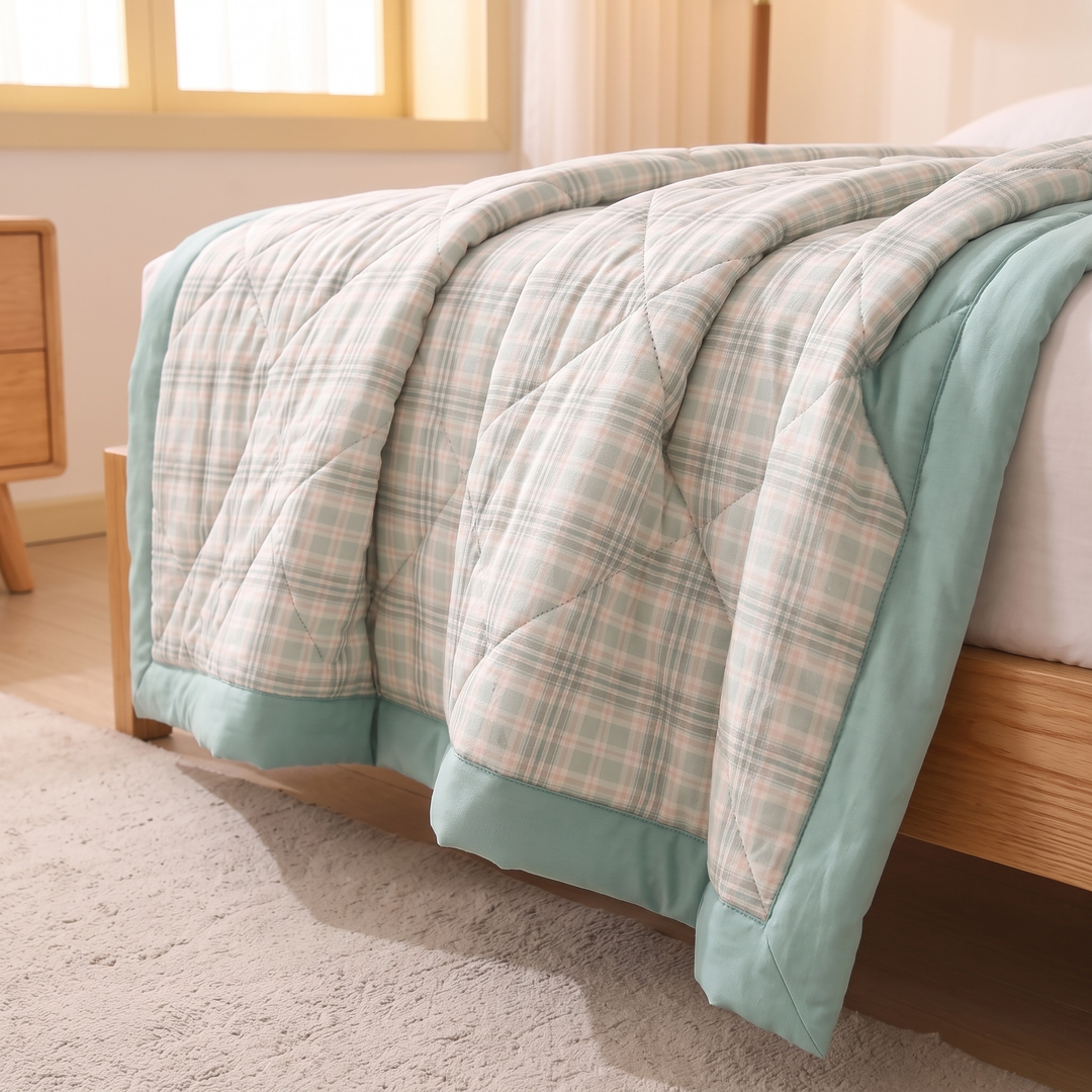 Lightweight Quilted Coverlet in Mint Plaid – hanging over the bed&