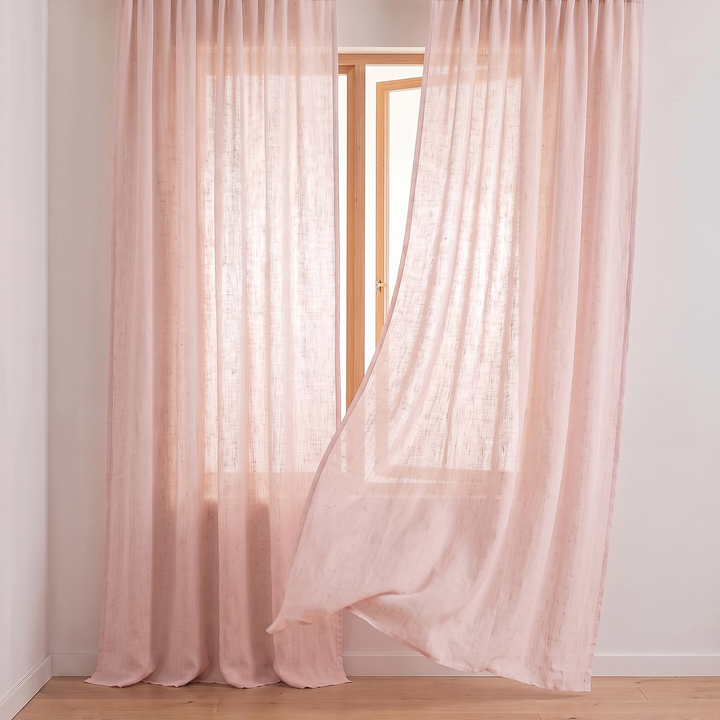 Linen Curtain Panel – Light Filtering, Rod Pocket in Light Pink – one panel lifted by a breeze at an open wooden casement window