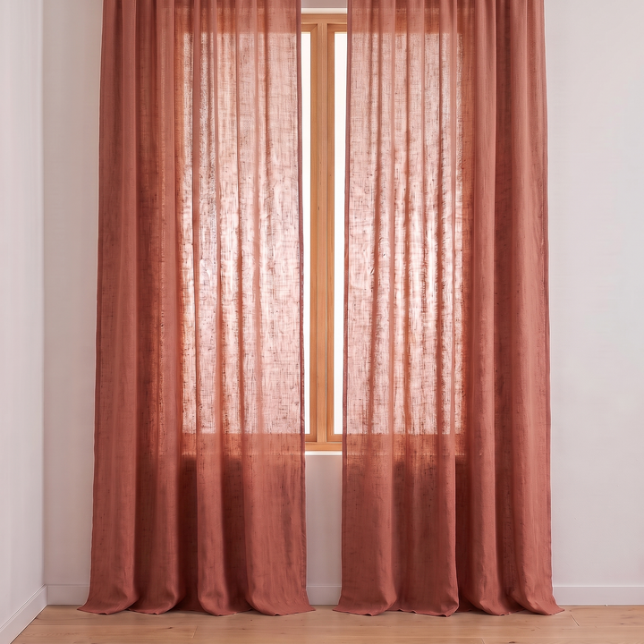 Linen Curtain Panel – Light Filtering, Rod Pocket in Rust – front view framing a tall narrow wood-framed window