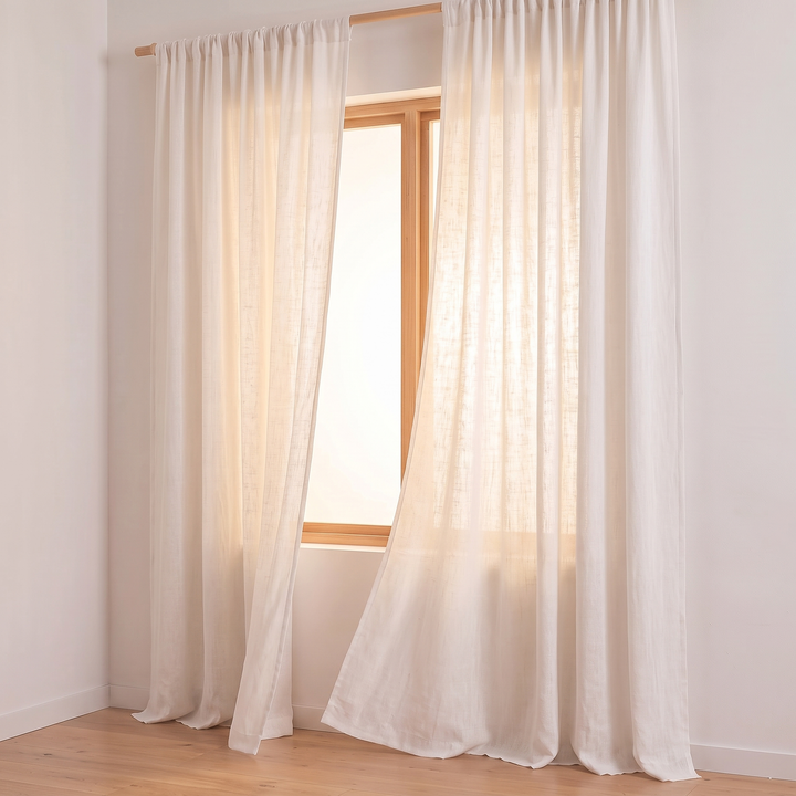 Linen Curtain Panel – Light Filtering, Rod Pocket in White – side angle of panels billowing gently with daylight behind