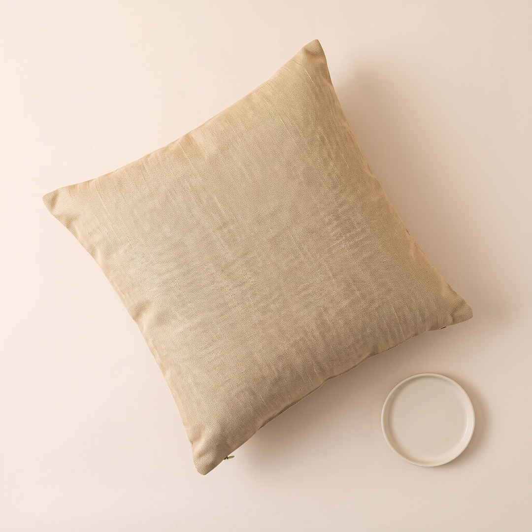 Linen-Look Pillow Cover in Beige – top-down view beside a small white ceramic dish