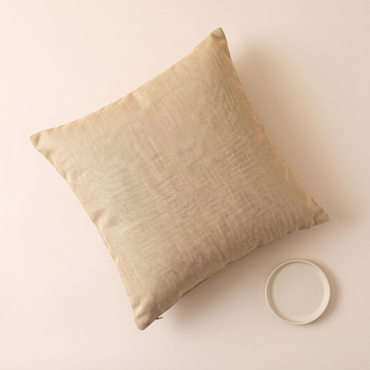 Linen-Look Pillow Cover in Beige – top-down view beside a small white ceramic dish