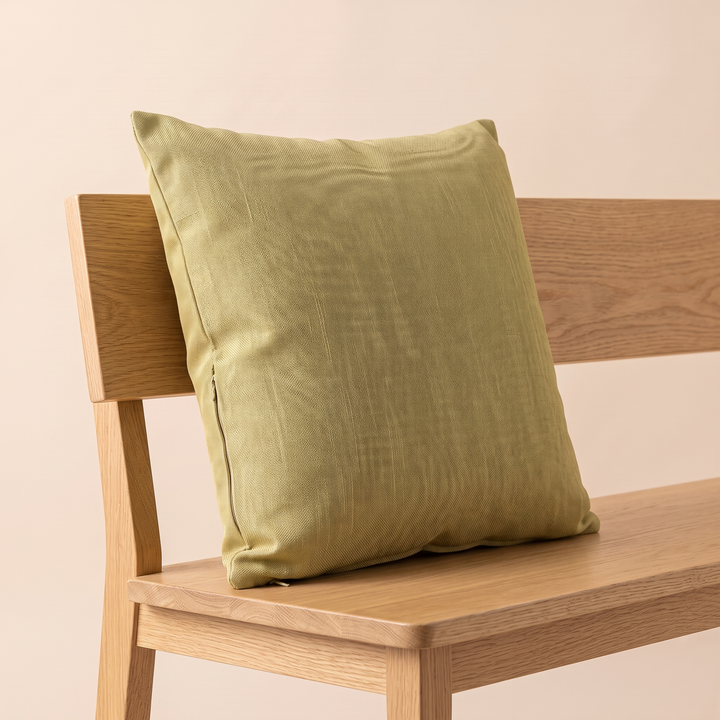 Linen-Look Pillow Cover in Khaki – propped against the backrest of a light oak bench