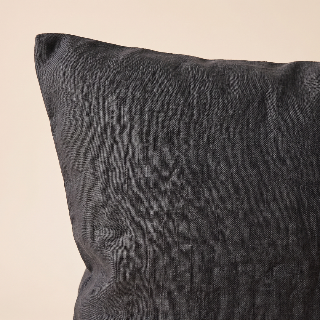 Linen Pillow Cover – 100% Linen in Black – close-up of the corner and woven texture against cream