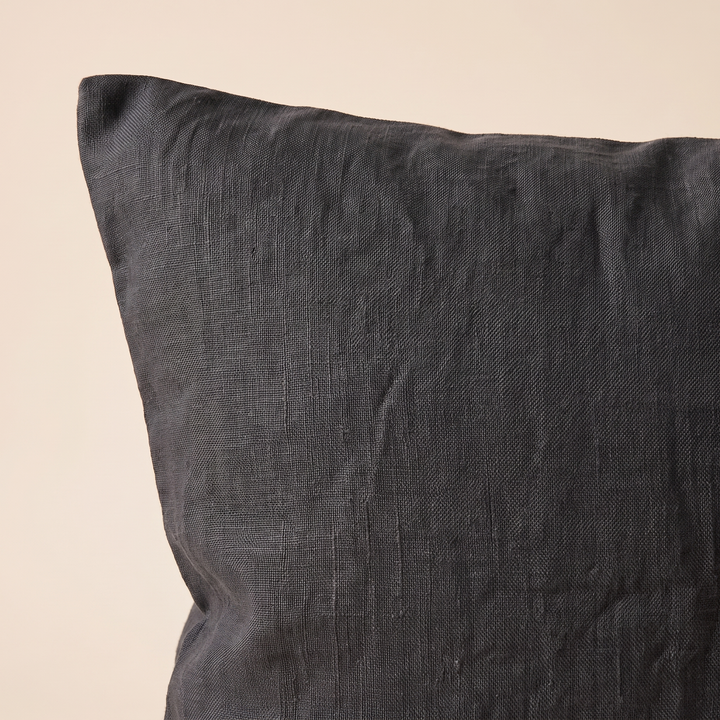 Linen Pillow Cover – 100% Linen in Black – close-up of the corner and woven texture against cream