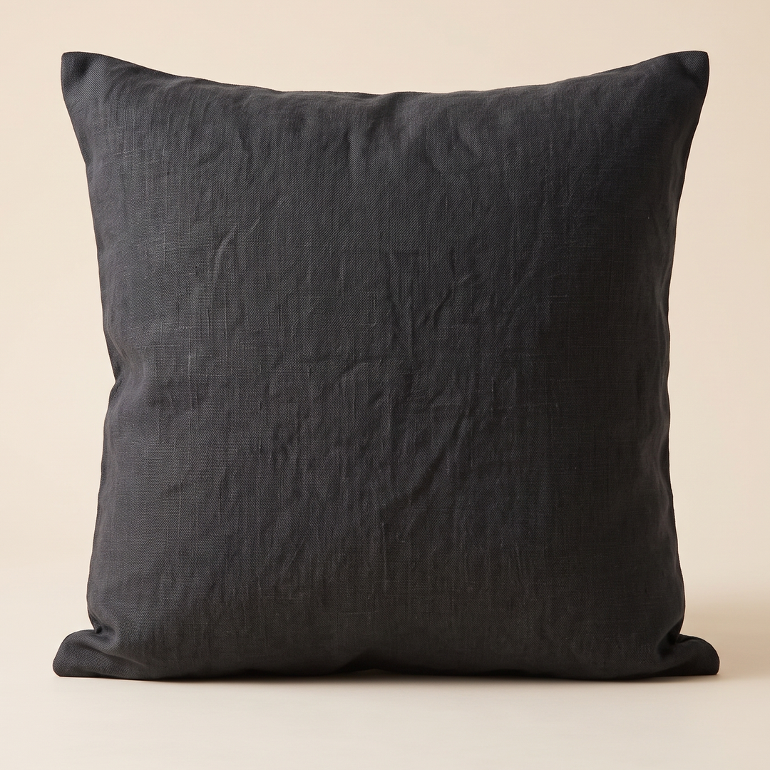 Linen Pillow Cover – 100% Linen in Black – standing upright against a plain cream background, front view