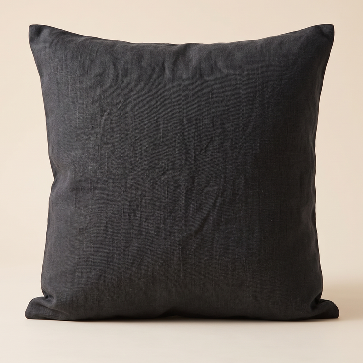 Linen Pillow Cover – 100% Linen in Black – standing upright against a plain cream background, front view