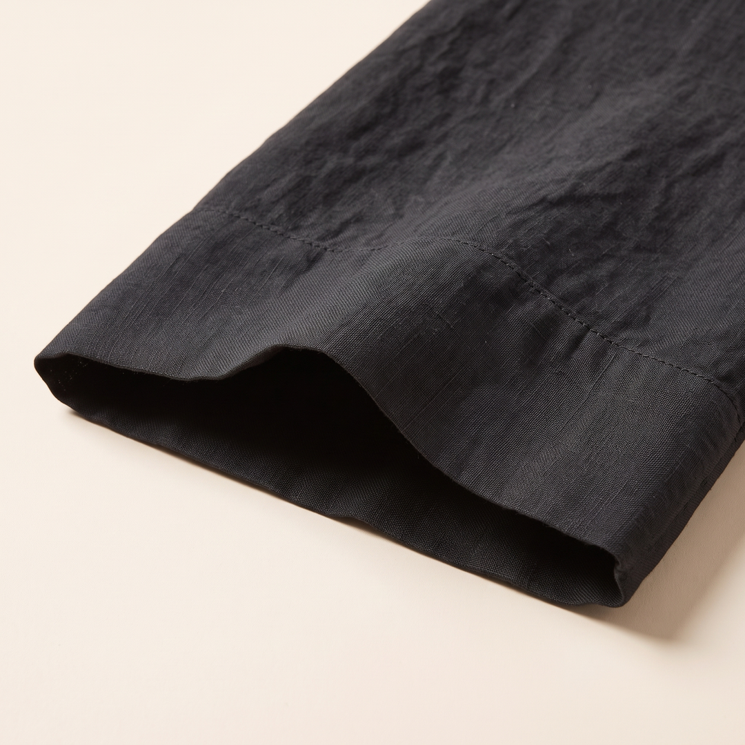 Linen Pillowcases – Set of 2 in Black – close-up of the stitched hem and crinkled fabric texture