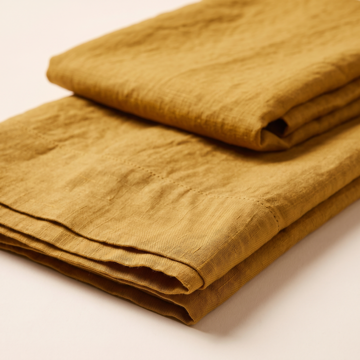 Linen Pillowcases – Set of 2 in Mustard – low angle view of layered folded edges in foreground