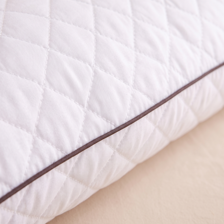 Long Body Pillow – Quilted in White – close-up of diamond quilting and brown piped edge