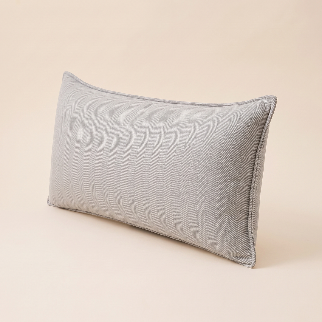 Long Lumbar Pillow Cover in Light Gray – turned at a three-quarter angle showing piped side edge