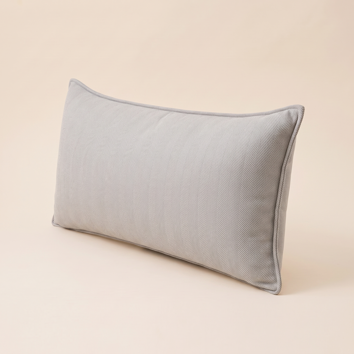Long Lumbar Pillow Cover in Light Gray – turned at a three-quarter angle showing piped side edge