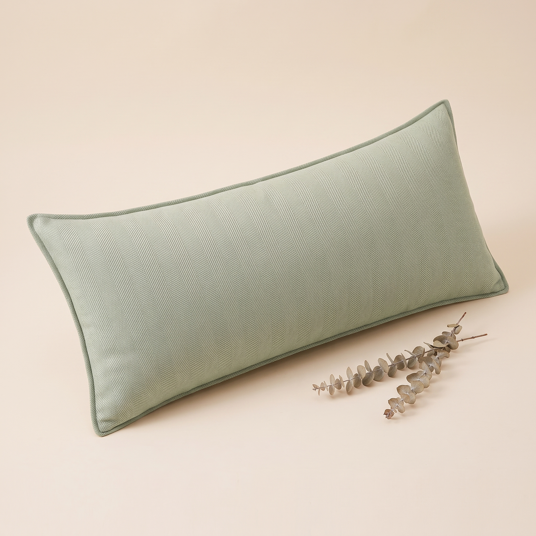 Long Lumbar Pillow Cover in Mint Green – styled with two dried eucalyptus sprigs resting beside it