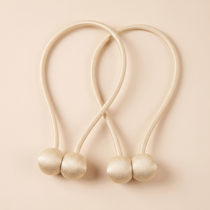 Magnetic Curtain Tiebacks – Set of 2 in Cream – top-down flat lay with rope loops crossing over each other