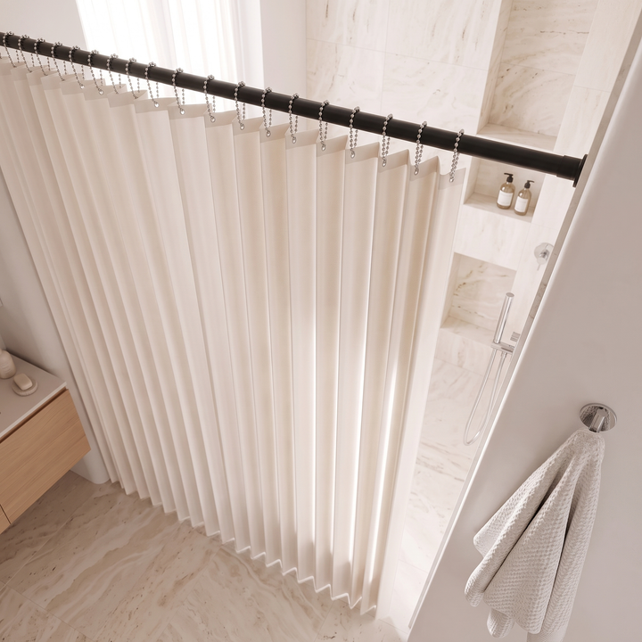 Walk-In Shower Curtain – Magnetic, Folding in Oatmeal – pleated folds seen from above beside marble shower niche