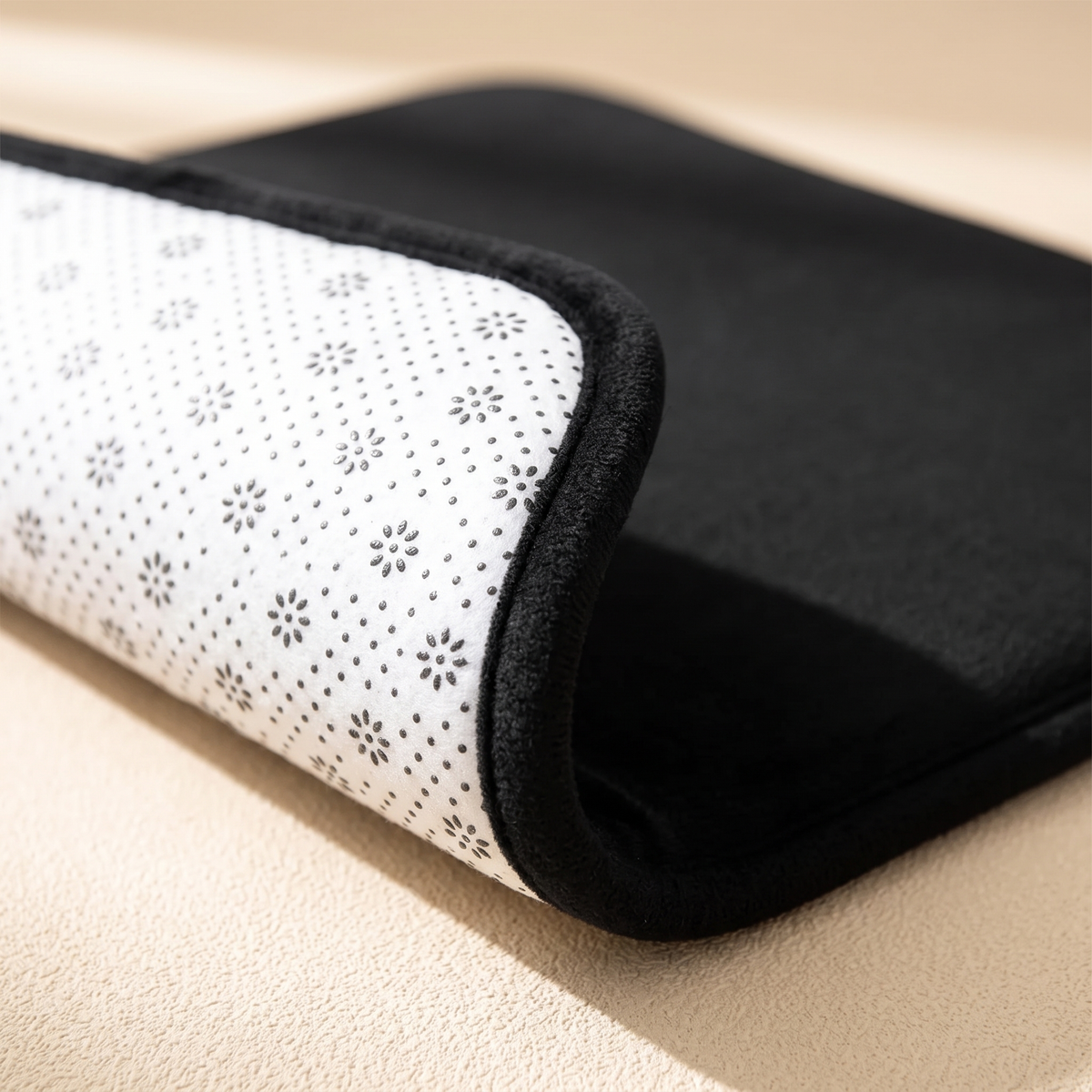Non-Slip Memory Foam Bath Mat – Plush in Black – close-up of the dotted non-slip backing on a turned-up corner