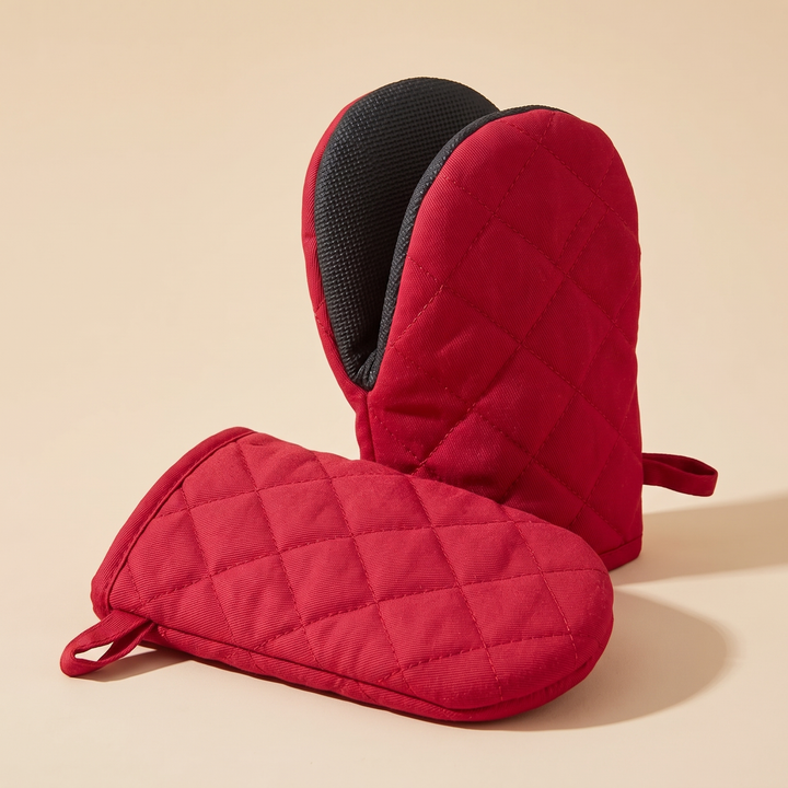 Mini Oven Mitts – Quilted, Pair in Cherry Red – one standing upright behind the other lying flat, loops visible