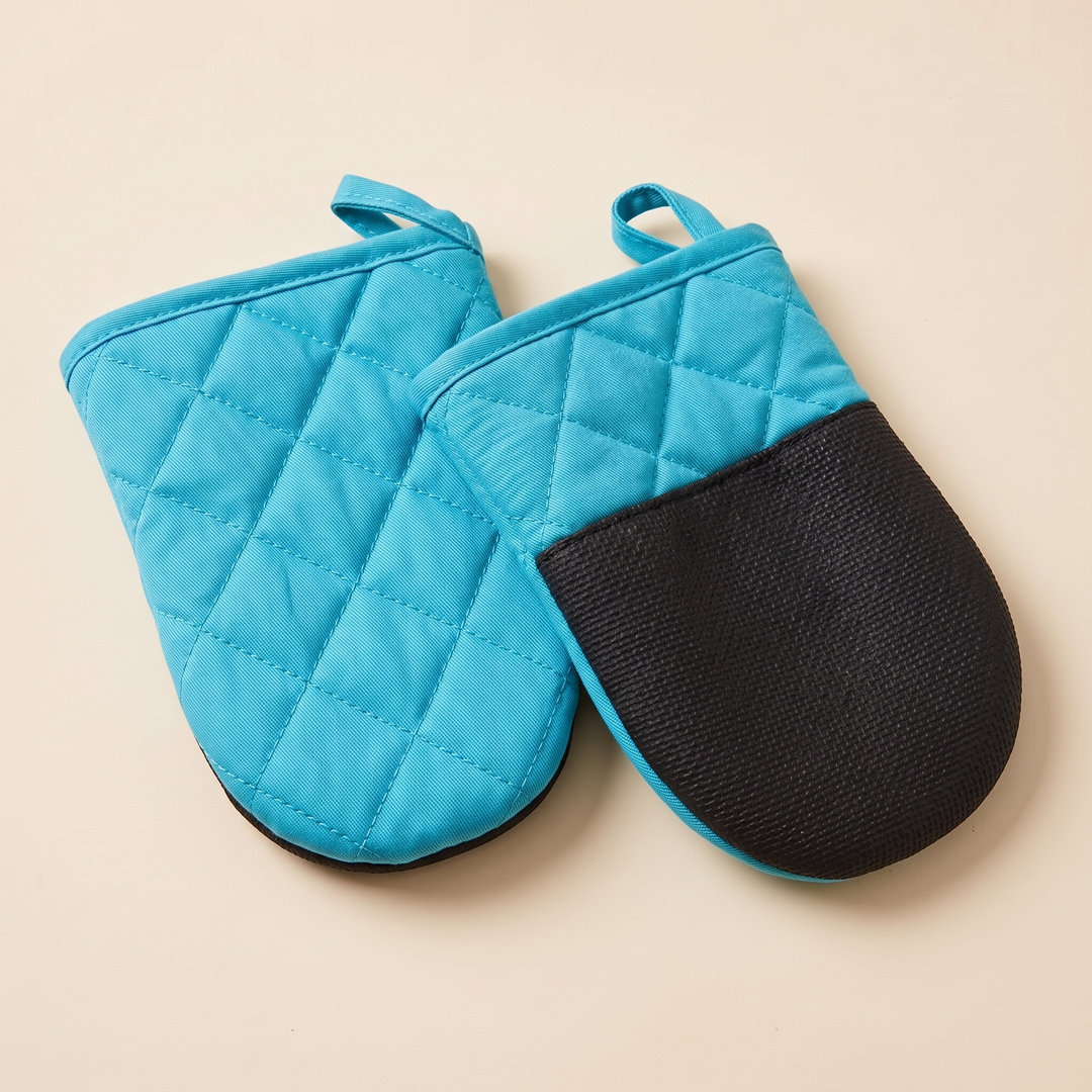 Mini Oven Mitts – Quilted, Pair in Turquoise – pair laid overlapping, quilted front beside grip side