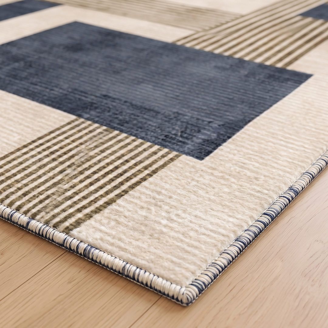 Modern Geometric Rug – Washable in Navy Blue – close-up of a corner and finished edge on wood flooring