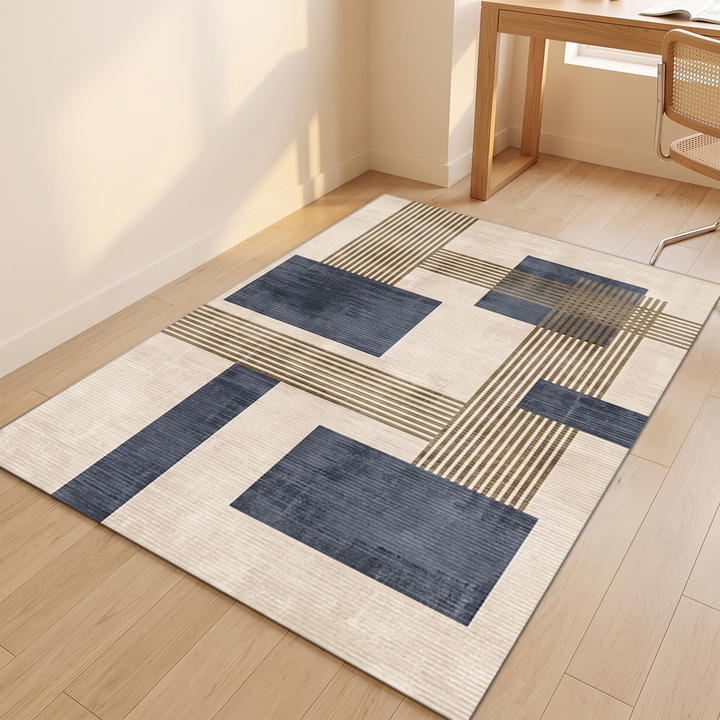 Modern Geometric Rug – Washable in Navy Blue – laid flat on a light wood floor near a desk