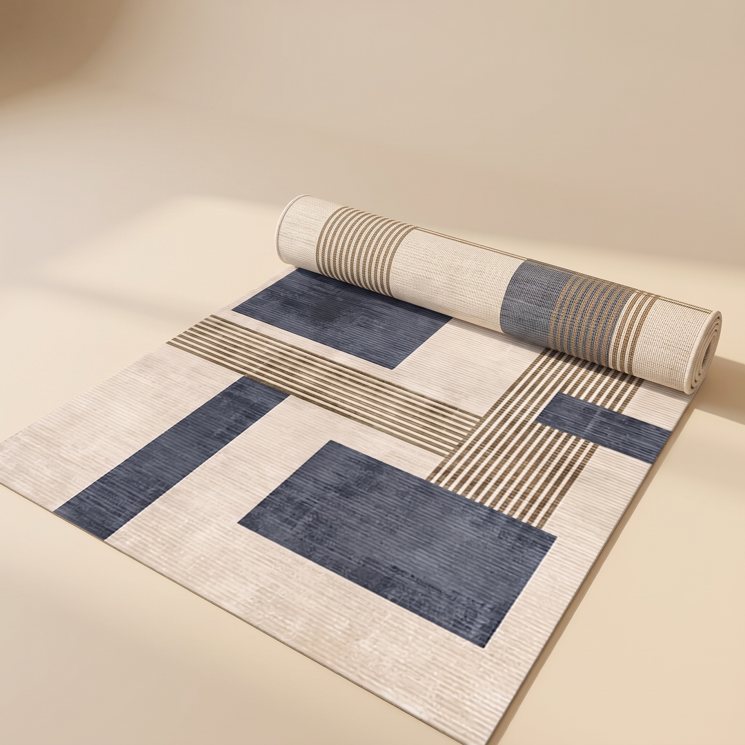 Modern Geometric Rug – Washable in Navy Blue – partially rolled up on a smooth beige studio floor