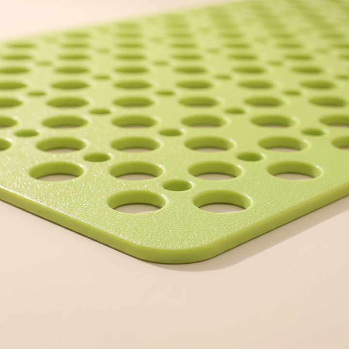 Non-Slip Shower Mat with Suction Cups in Lime Green – close-up of the textured surface and drainage holes at one rounded corner
