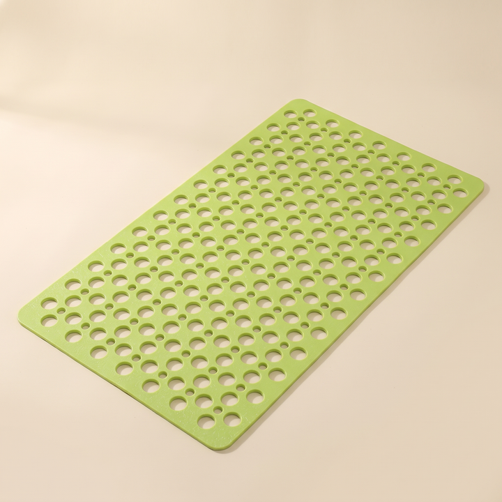 Non-Slip Shower Mat with Suction Cups in Lime Green – laid flat at an angle on a plain beige background