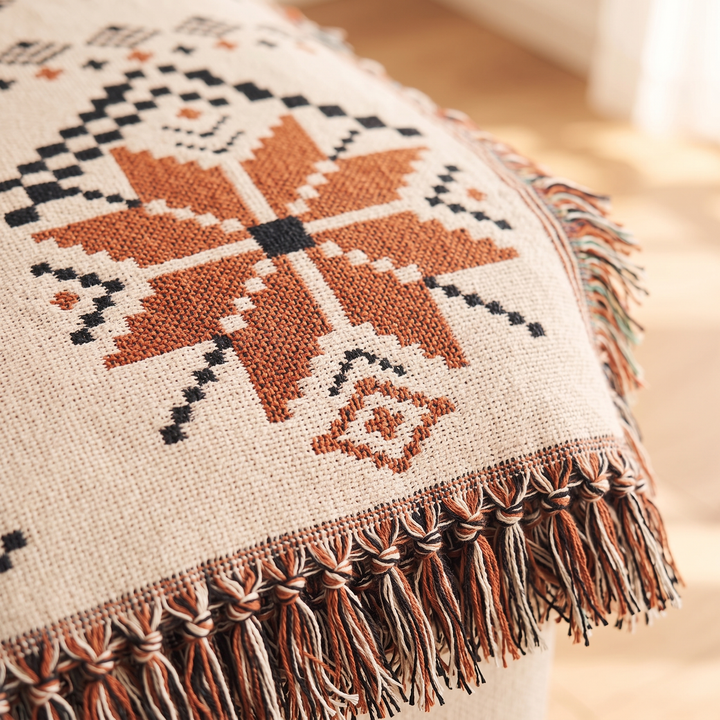 Nordic Snowflake Throw Blanket – Woven in Cream Snowflake – close-up of the woven snowflake motif and tasselled fringe edge