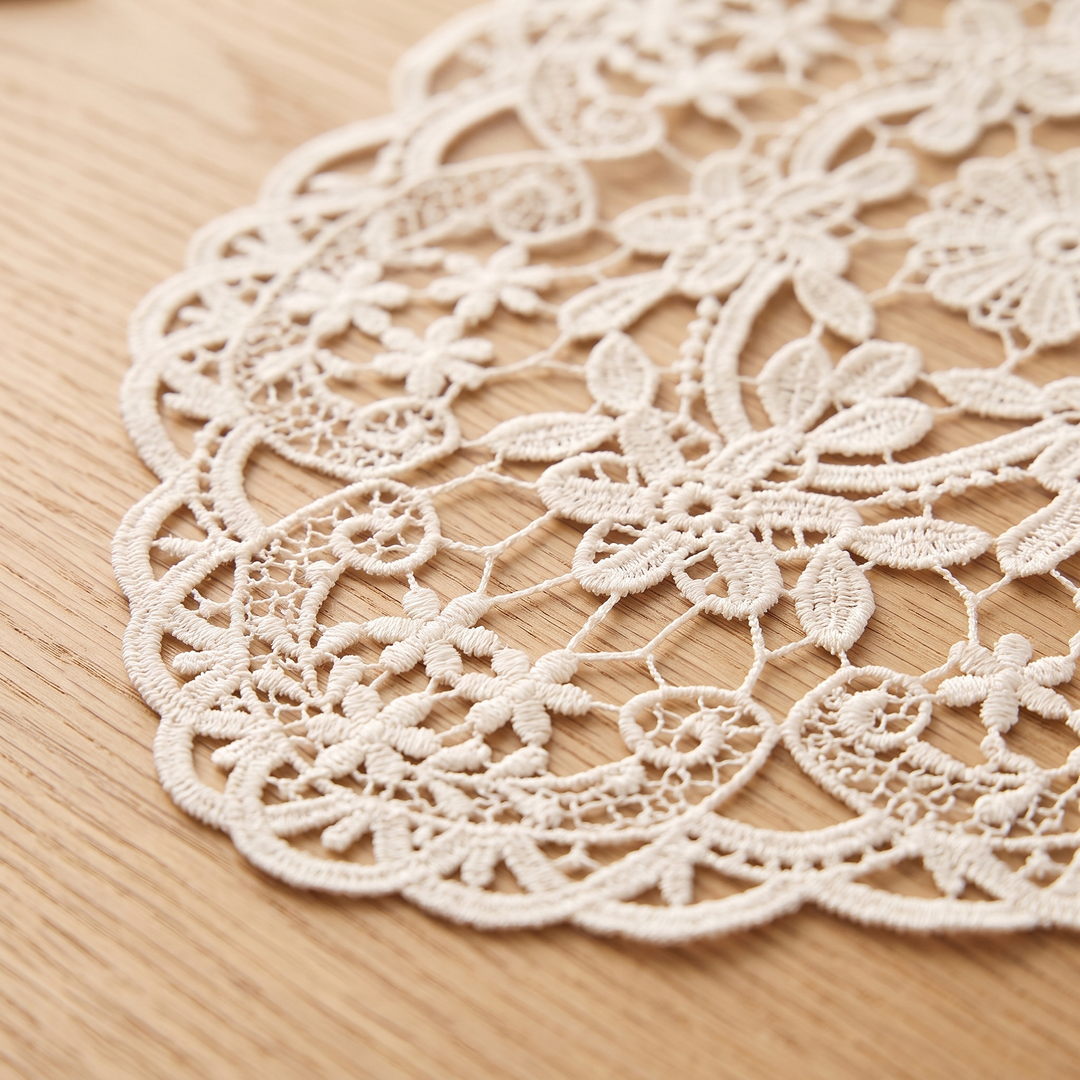 Oval Lace Placemats – Embroidered in Cream – close-up of the embroidered flowers and scalloped edge