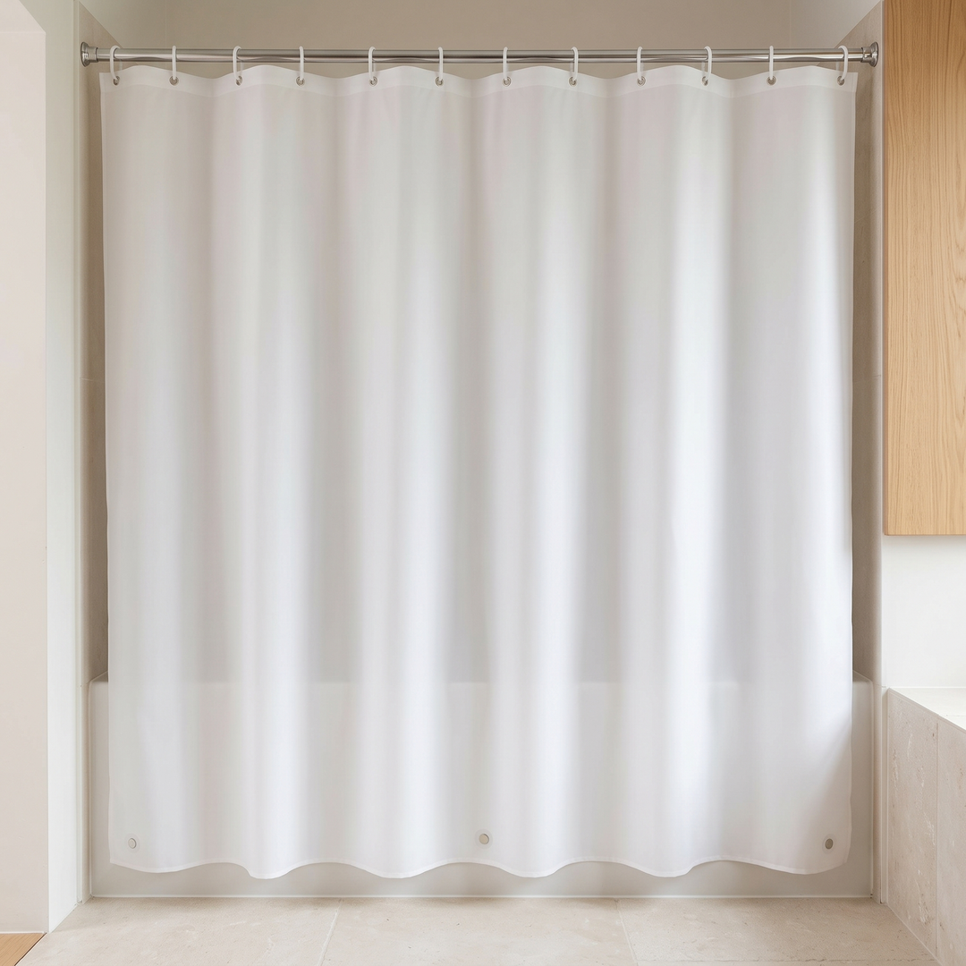 Shower Curtain Liner – Clear PEVA with Magnets in White – hanging from a rod across a bathtub alcove, front view