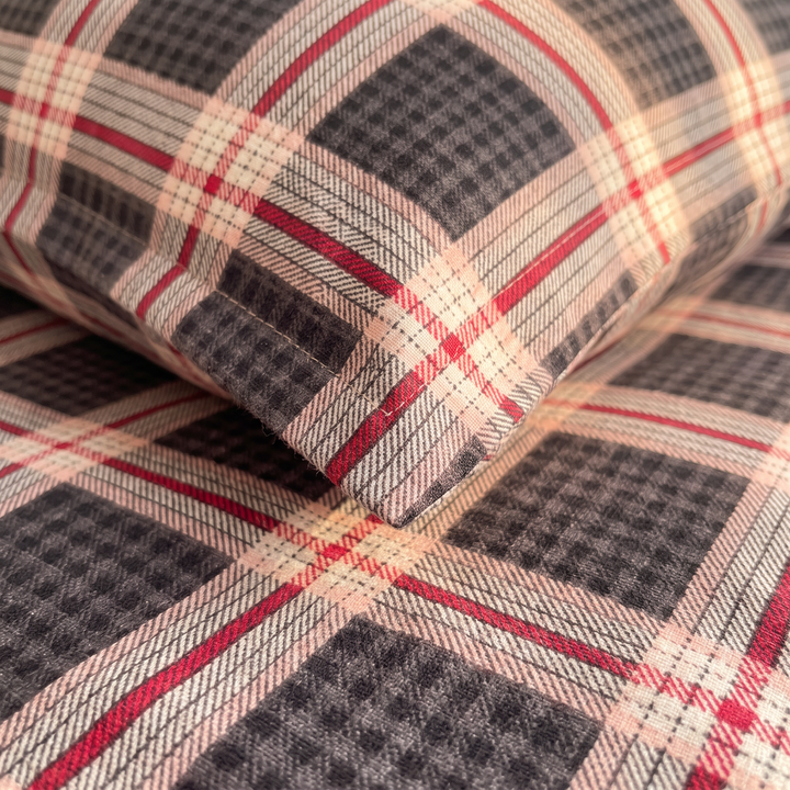 Plaid Bedding Set in Charcoal Plaid – close-up of pillowcase corner resting on the checked fabric