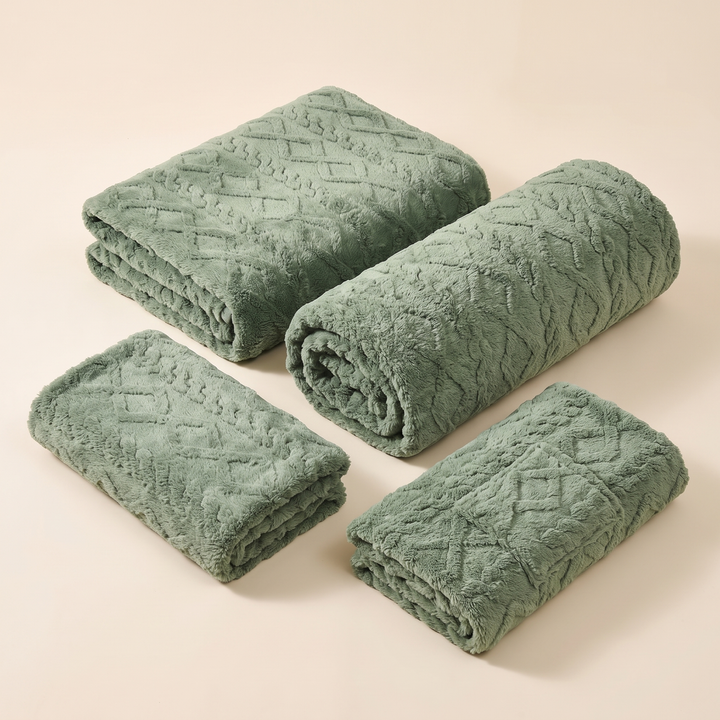 Plush Stretch Recliner Cover in Sage – four folded and rolled textured pieces arranged on a plain beige background
