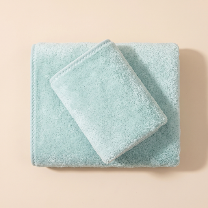 Plush Bath Towel Set – 2 Piece in Aqua – overhead view of small towel angled on larger folded towel