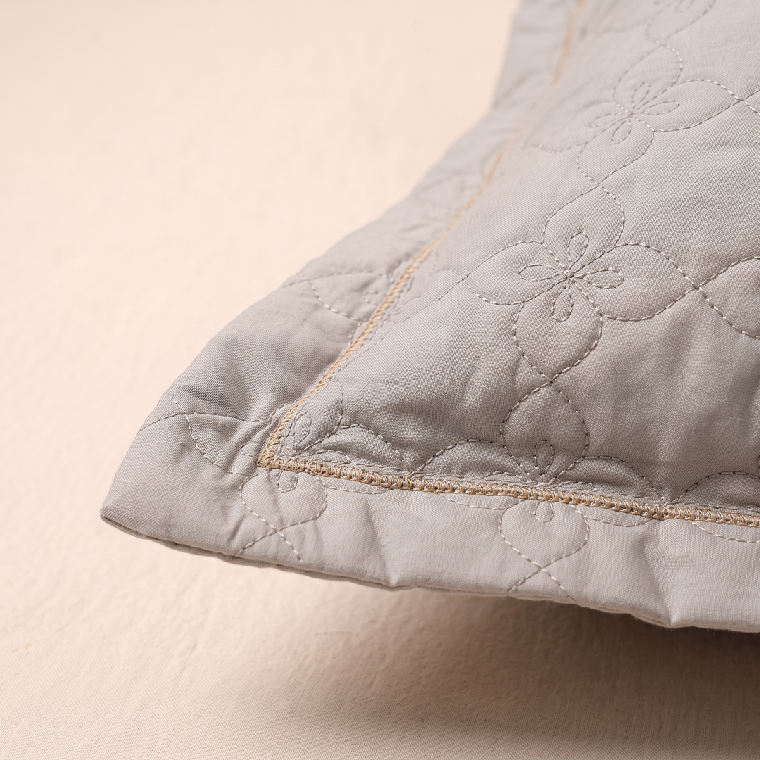 Quilted Cotton Pillow Shams – Set of 2 in Gray – close-up of one corner showing quilted floral stitching and tan trim