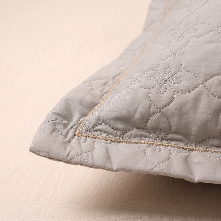 Quilted Cotton Pillow Shams – Set of 2 in Gray – close-up of one corner showing quilted floral stitching and tan trim