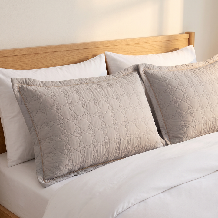 Quilted Cotton Pillow Shams – Set of 2 in Gray – two shams propped against an oak headboard on a made bed