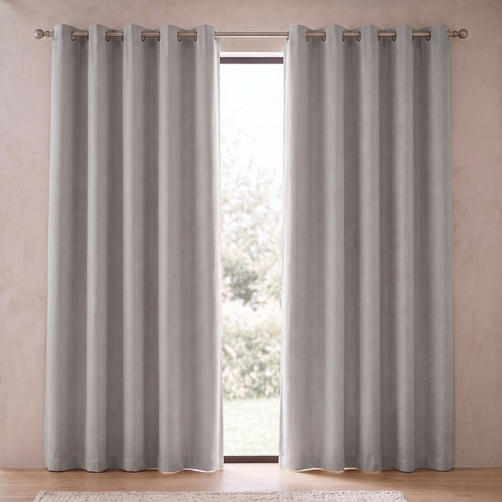 Room Darkening Curtain Panel – Grommet Top in Gray – full-length front view against a textured wall with wood flooring