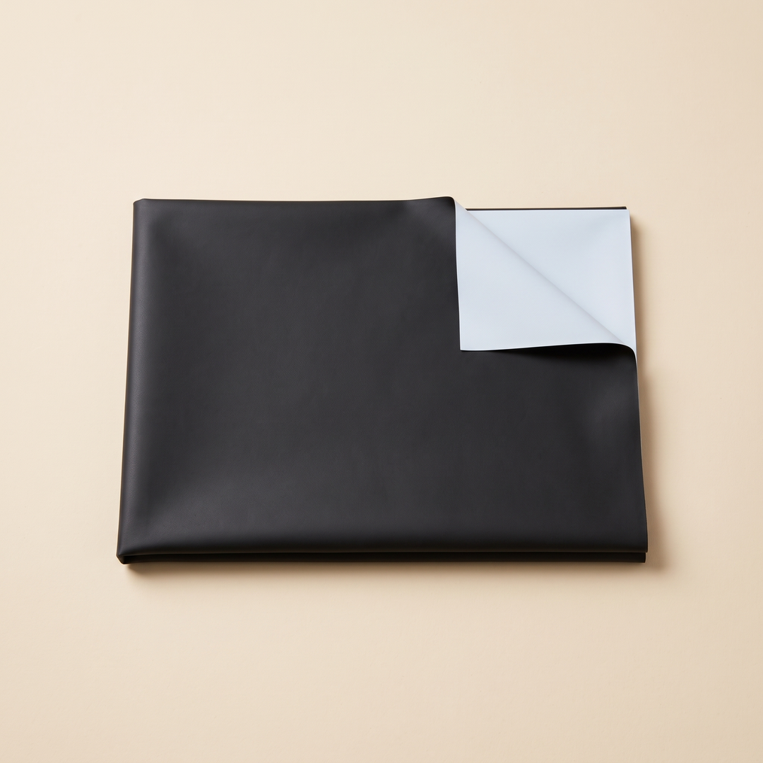 Room-Darkening Window Cover – Cut to Size in Black – folded flat on a cream background with one corner turned over