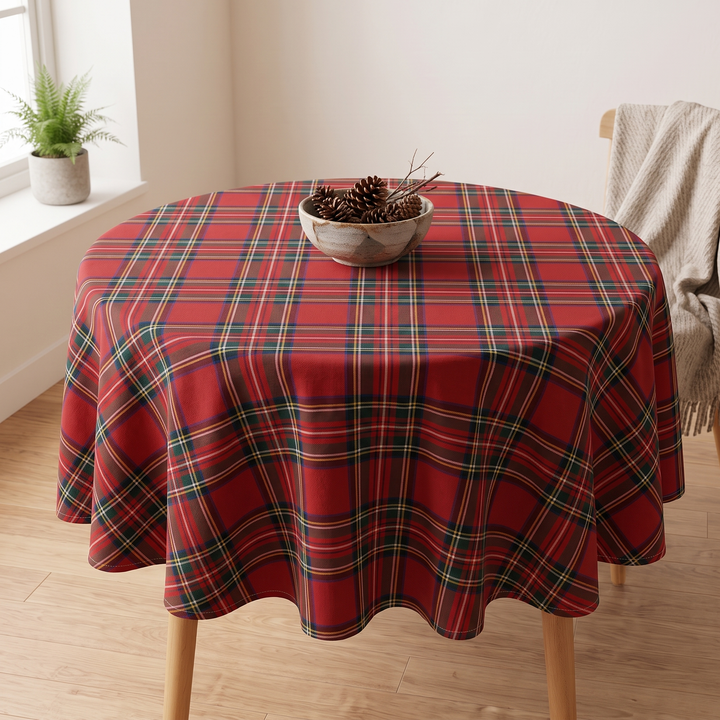 Round Christmas Tablecloth – Plaid in Red Tartan – styled with a pinecone bowl near a sunny windowsill fern