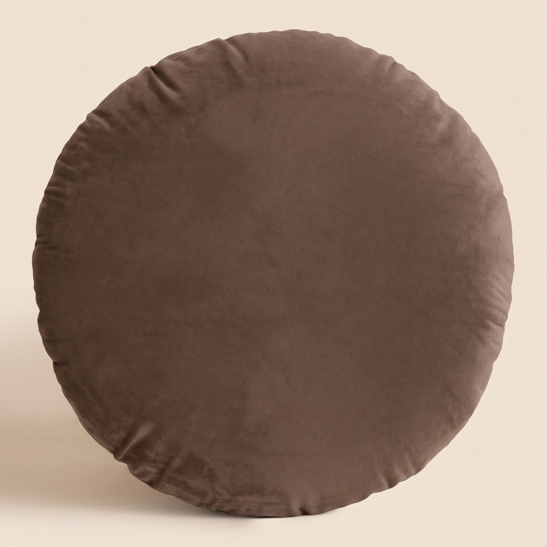 Round Velvet Pillow Cover in Chocolate Brown – front view standing upright against a plain beige background