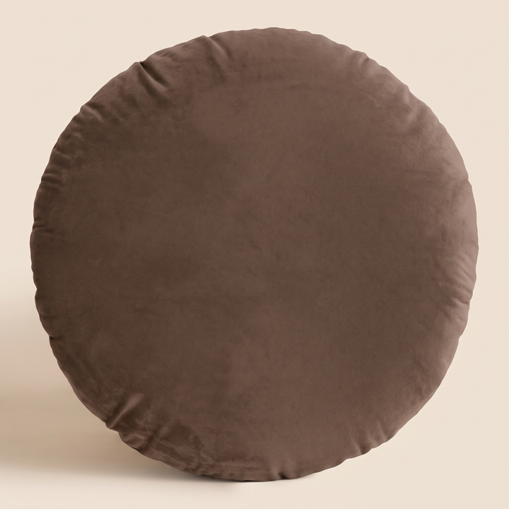 Round Velvet Pillow Cover in Chocolate Brown – front view standing upright against a plain beige background